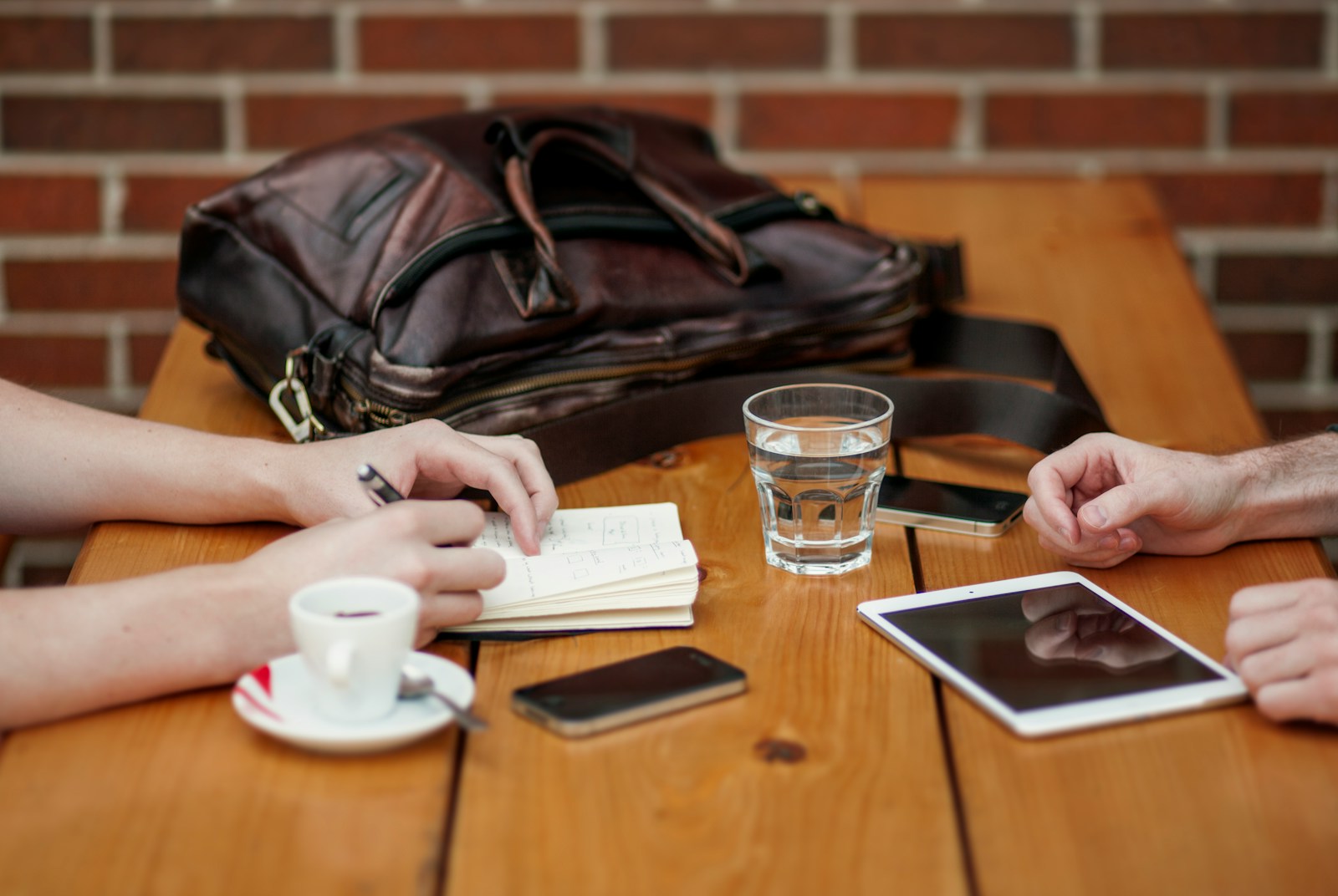 two person sitting in front of table